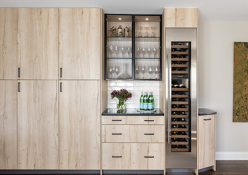 Kitchen with an integrated wine refrigerator